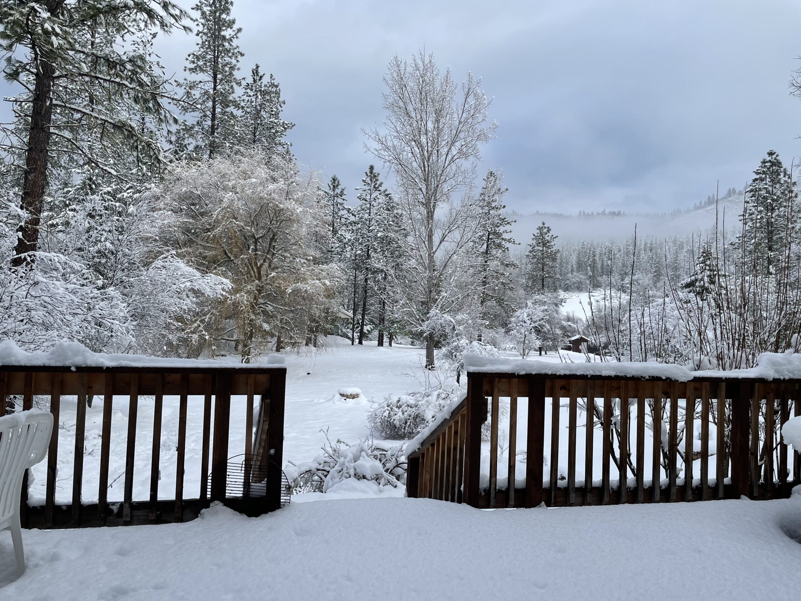 Snow-covered River Rock Cabin in winter